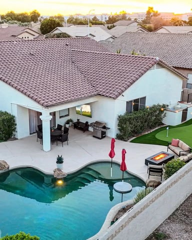 Aerial view of a backyard pool and putting green at a Desert Pine Stays home in Chandler